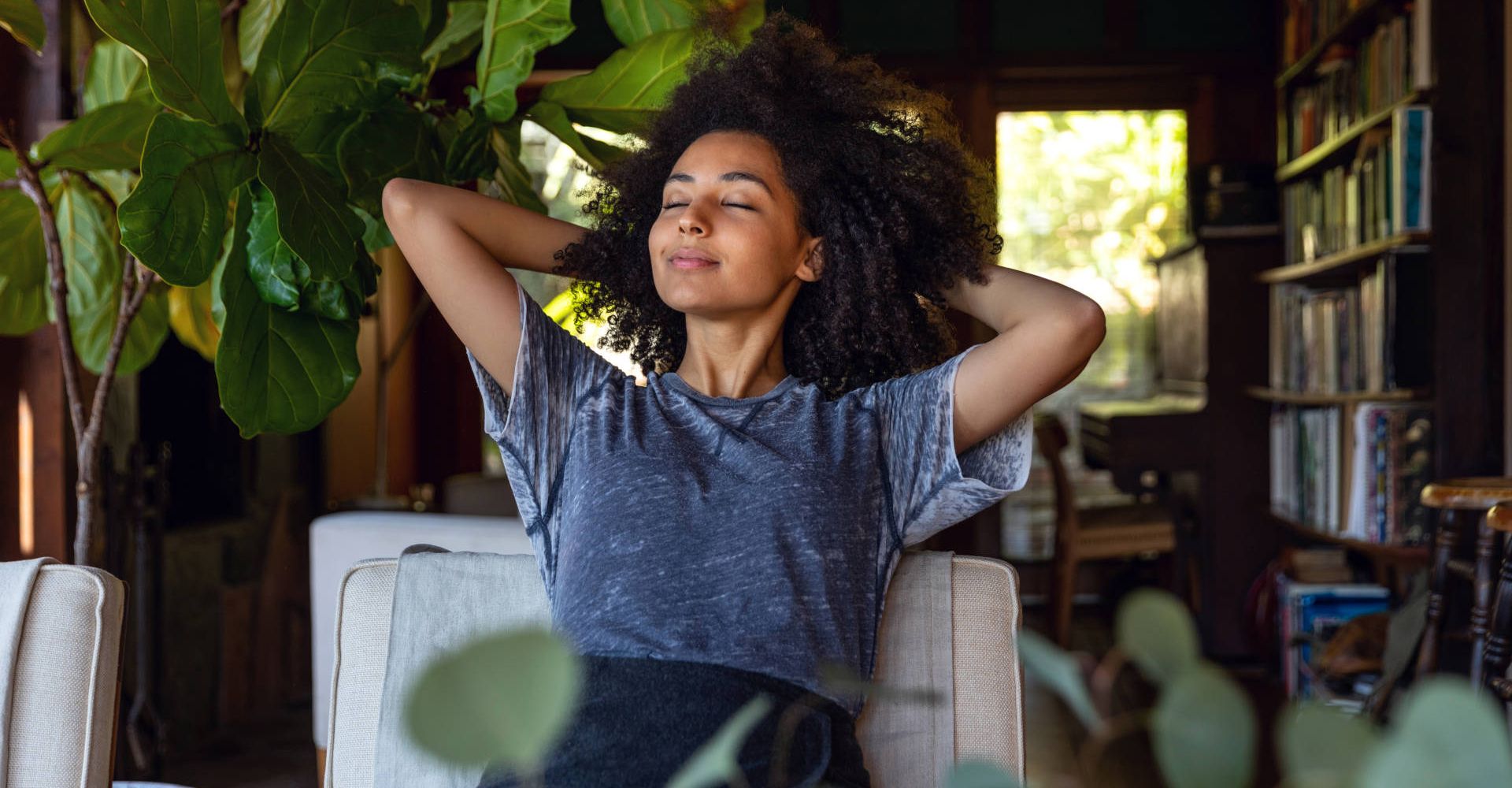 A woman relaxing with her hands behind her head