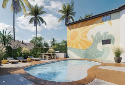 Outdoor pool next to apartment building with a mural wall art