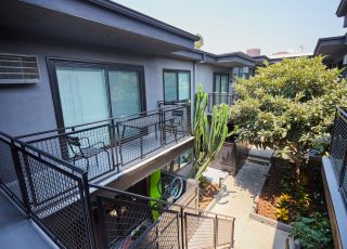 Apartment patio stairs leading to the courtyard at Beau on Bundy