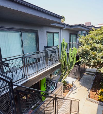 Apartment patio stairs leading to the courtyard at Beau on Bundy