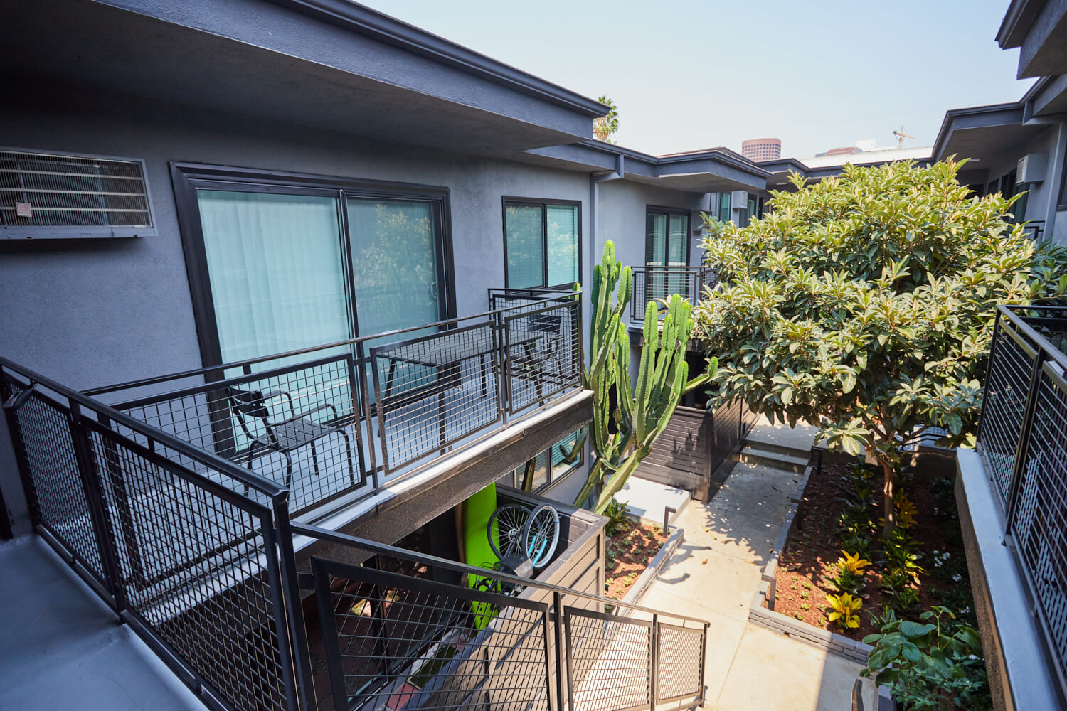 Apartment patio stairs leading to the courtyard at Beau on Bundy