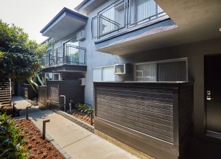 The walkway behind the Beau on Bundy apartment building