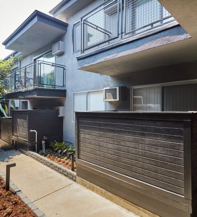 The walkway behind the Beau on Bundy apartment building