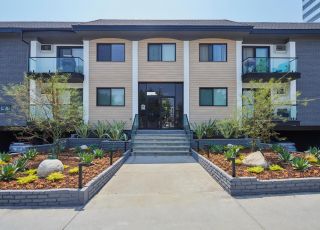 West LA Apartments; Beau on Bundy exterior in the amidst of two cactus gardens