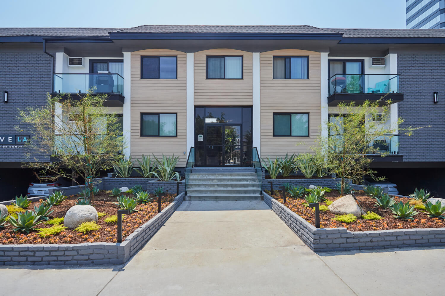 West LA Apartments; Beau on Bundy exterior in the amidst of two cactus gardens