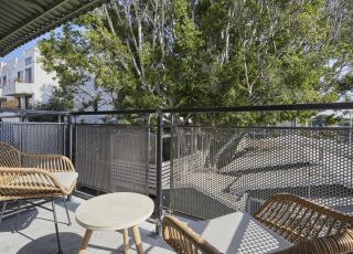 Apartment balcony decorated with patio furnitures
