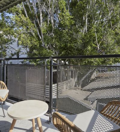 Apartment balcony decorated with patio furnitures