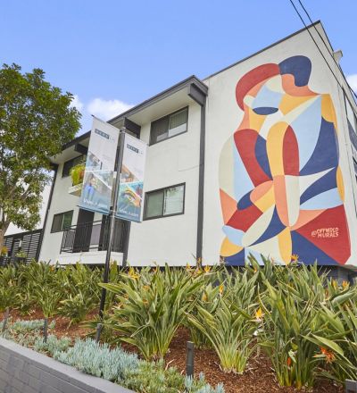 Apartments in West Hollywood; Callie on Curson exterior with a wall mural and raised garden beds in the front