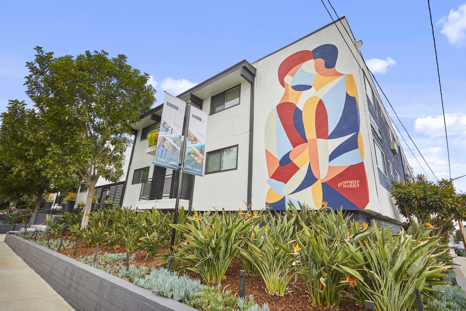 Apartments in West Hollywood; Callie on Curson exterior with a wall mural and raised garden beds in the front