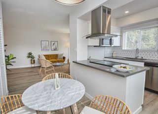 Open concept kitchen area next to the dining and living room area