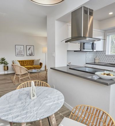 Open concept kitchen area next to the dining and living room area