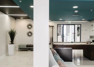 Communal entertainment area with a pool table and sitting space at Park Encino apartments