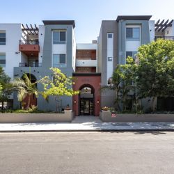 Exterior of the Park Encino apartments in LA amidst the greenery