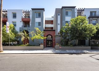 Exterior of the Park Encino apartments in LA amidst the greenery