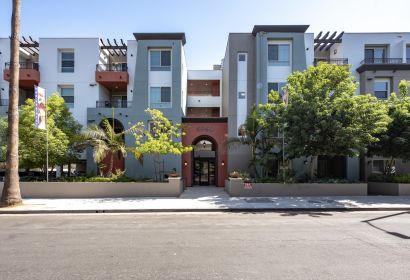 Exterior of the Park Encino apartments in LA amidst the greenery