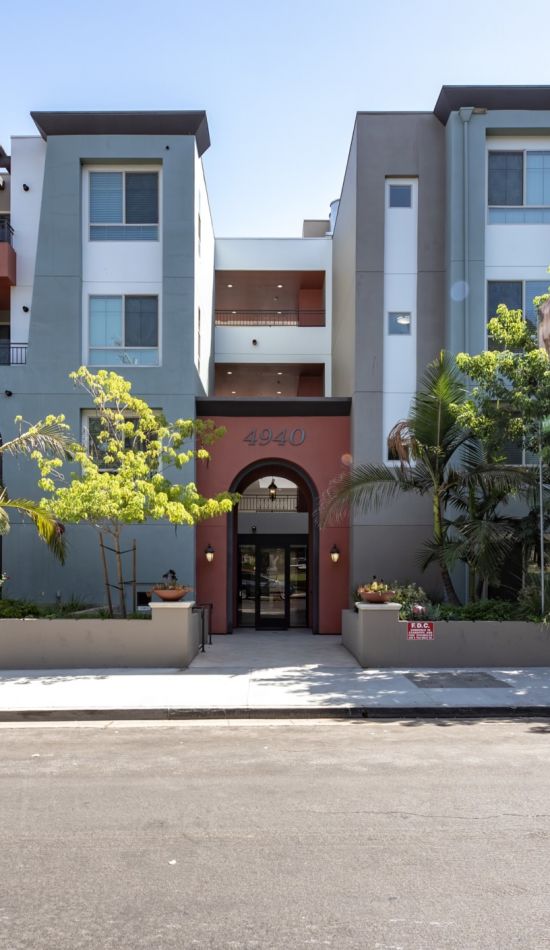 Exterior of the Park Encino apartments in LA amidst the greenery