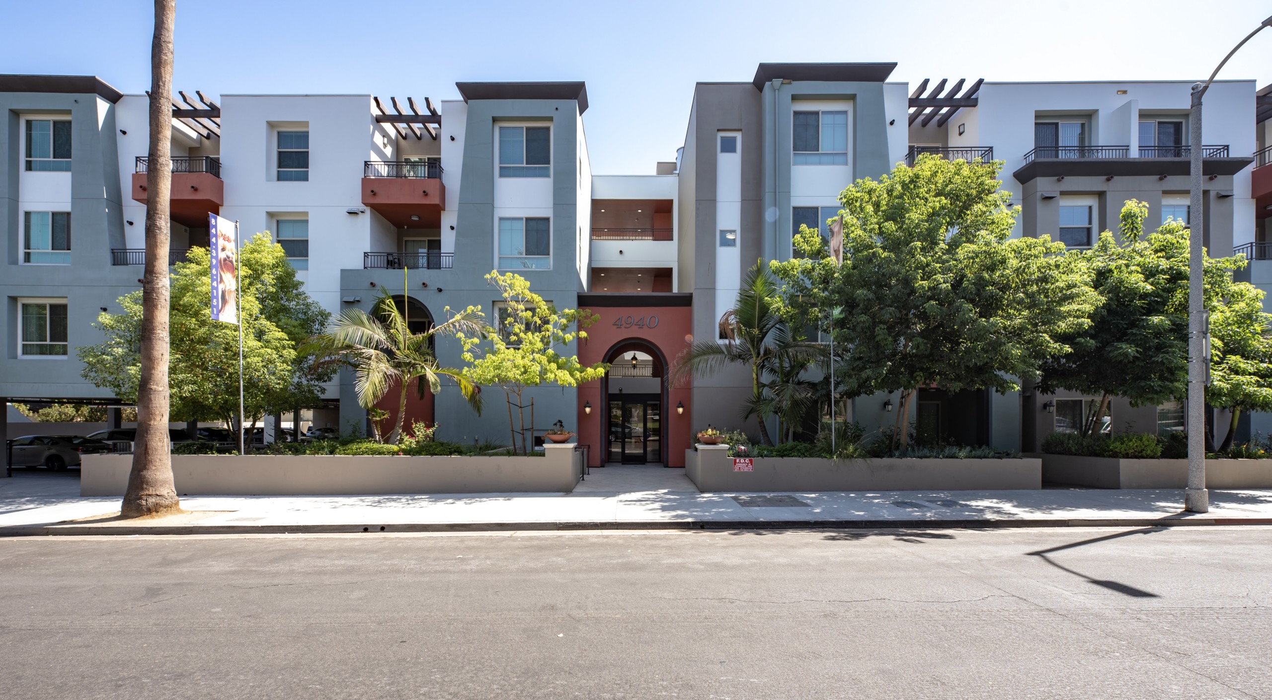 Exterior of the Park Encino apartments in LA amidst the greenery