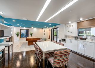 Dining area next to the kitchen sink countertop overlooking the game room at Park Encino
