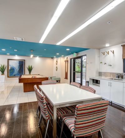 Dining area next to the kitchen sink countertop overlooking the game room at Park Encino
