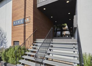 Stairs leading to the entrance of the Clover on Carlton building