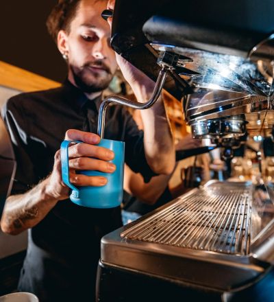 a barista making a latte