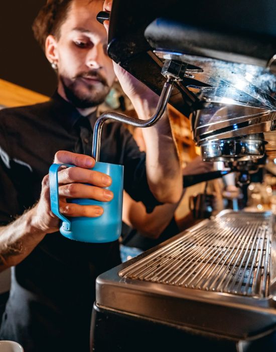 a barista making a latte