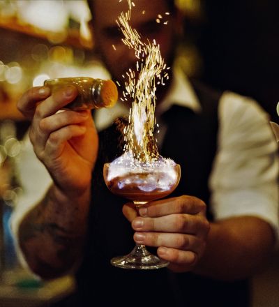 bartender making a fiery drink