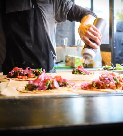 person cooking food in a restaurant