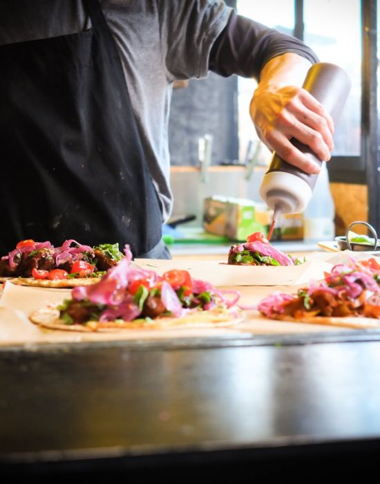 person cooking food in a restaurant