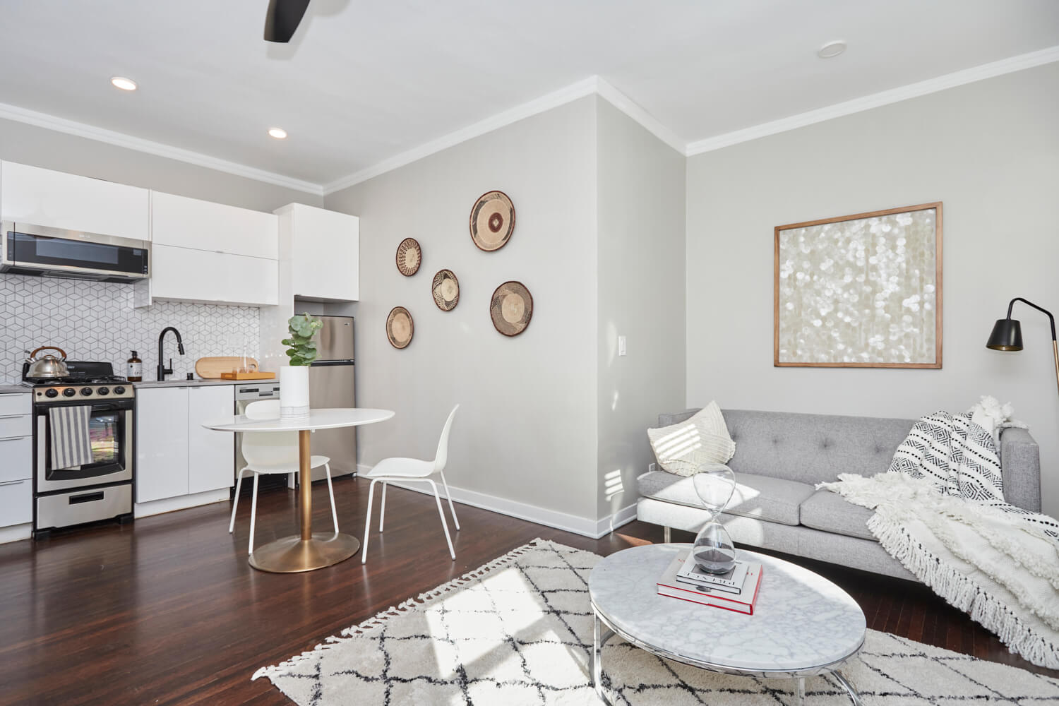 Wide shot of the kitchen next to the living room area at The Gershwin Garfield; Luxury Hollywood Rentals; boutique community apartments in Hollywood