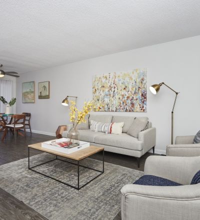 Living room area next to the dining space at Violet on Virgil Apartments
