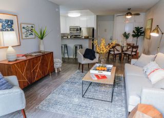 Living room next to the kitchen and dining area at Violet on Virgil