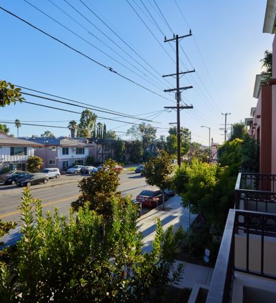 Patio overlooking the street with greenery