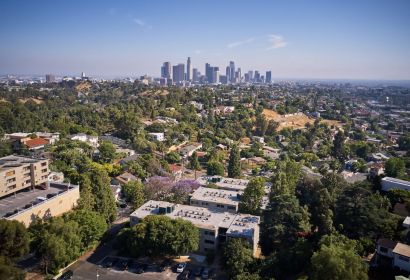 Aerial view of apartment with city skyline in the background; Milo on Morton building