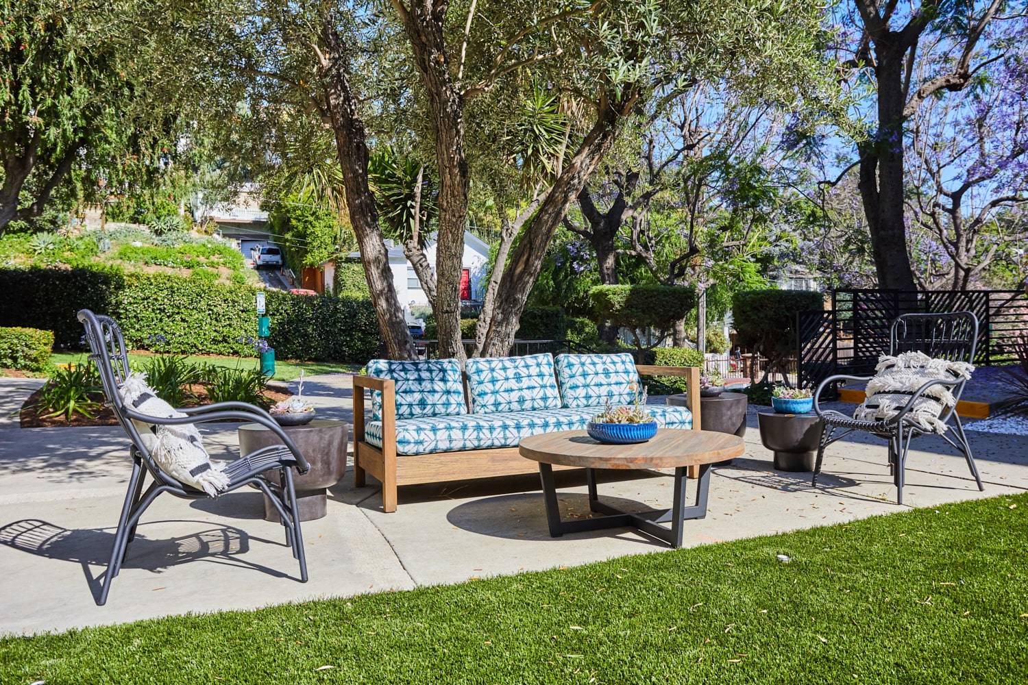 Seating area in backyard; Milo on Morton building exterior