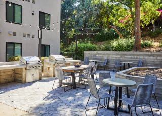 Barbeque and eating area; Milo on Morton building exterior