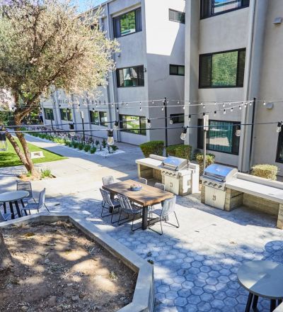 Aerial of barbeque & eating area; Milo on Morton building exterior
