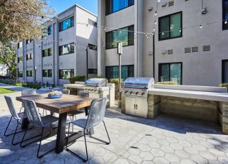 Barbeque and eating area close up; Milo on Morton building exterior