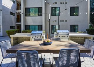 Barbeque and eating area close up; Milo on Morton building exterior