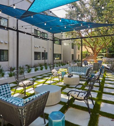Outdoor sitting area under canopy; Milo on Morton building exterior