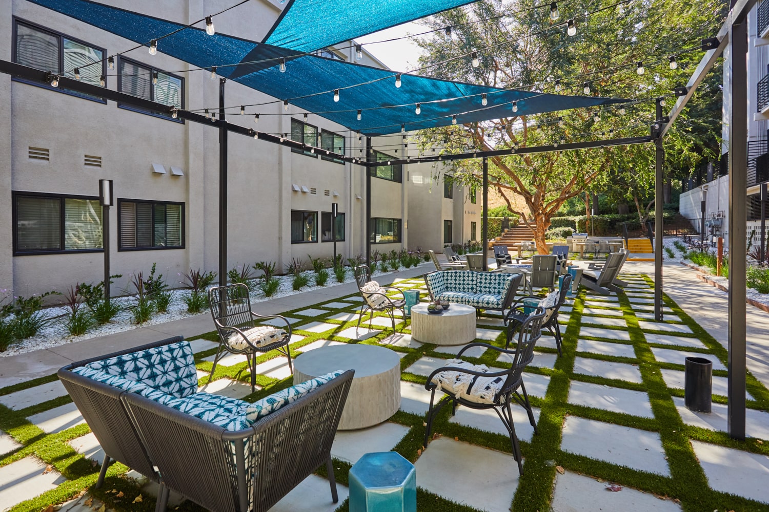 Outdoor sitting area under canopy; Milo on Morton building exterior