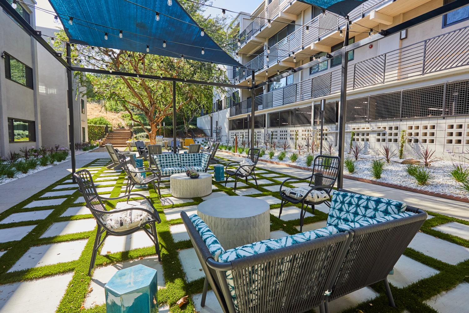 Outdoor sitting area under canopy; Milo on Morton building exterior