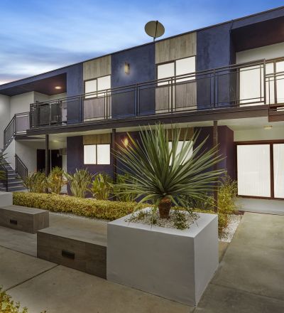 exterior of an apartment building at dusk