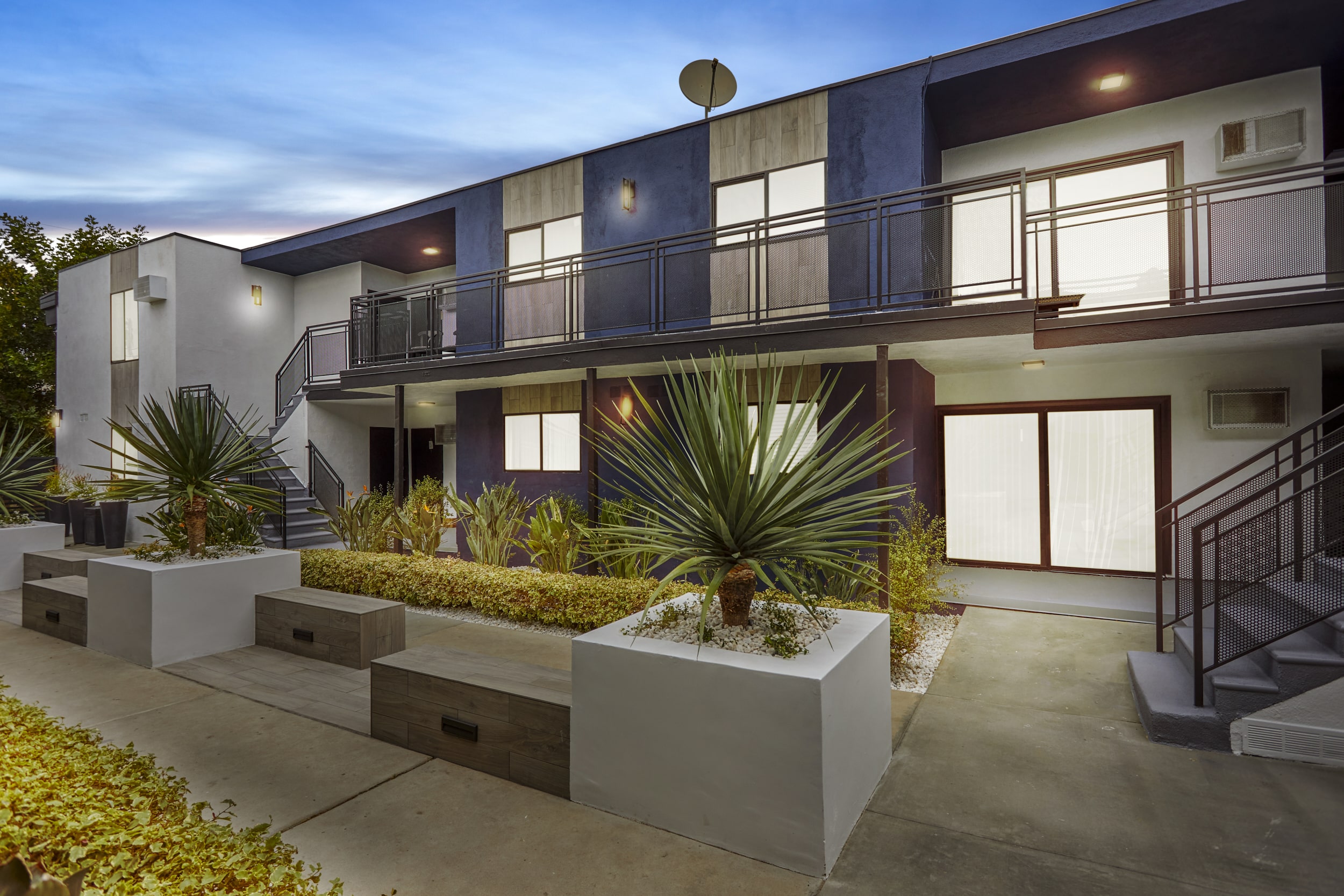 exterior of an apartment building at dusk