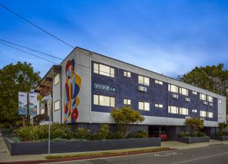exterior of an apartment building at dusk