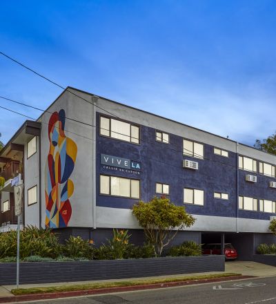 exterior of an apartment building at dusk