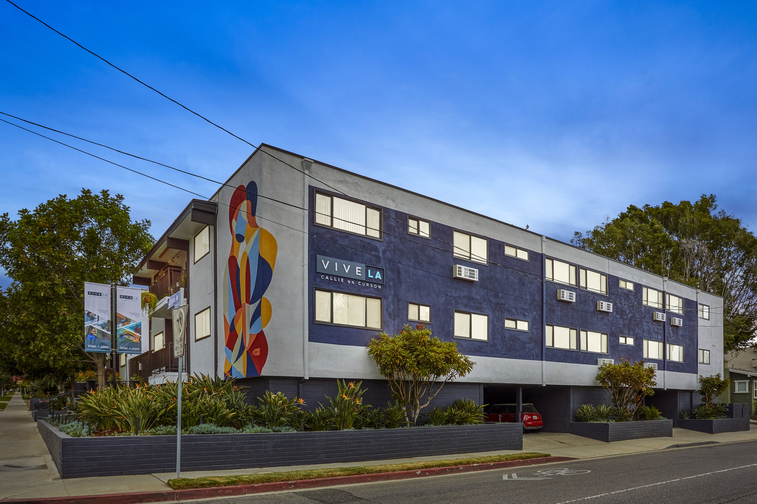 exterior of an apartment building at dusk