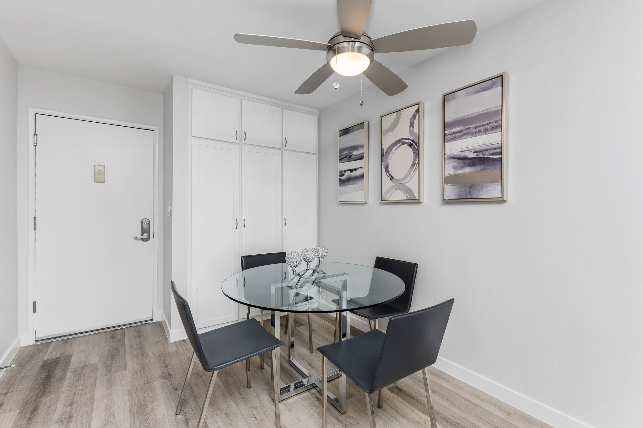 Violet On Virgil Apartments rental apartments photos; A cozy dining room with a small table and chairs, perfect for intimate gatherings.