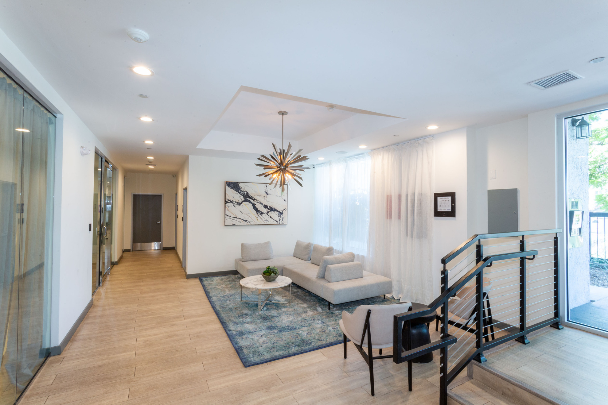 The Violet On Virgil Apartments; Virgil Avenue Los Angeles; The lobby of a building featuring a checkered floor, creating a visually striking pattern.