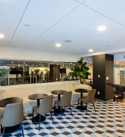 Next Apartments Los Angeles; The Violet Apartments In LA; An image of a building's lobby with a checkered floor, providing a stylish and sophisticated atmosphere.